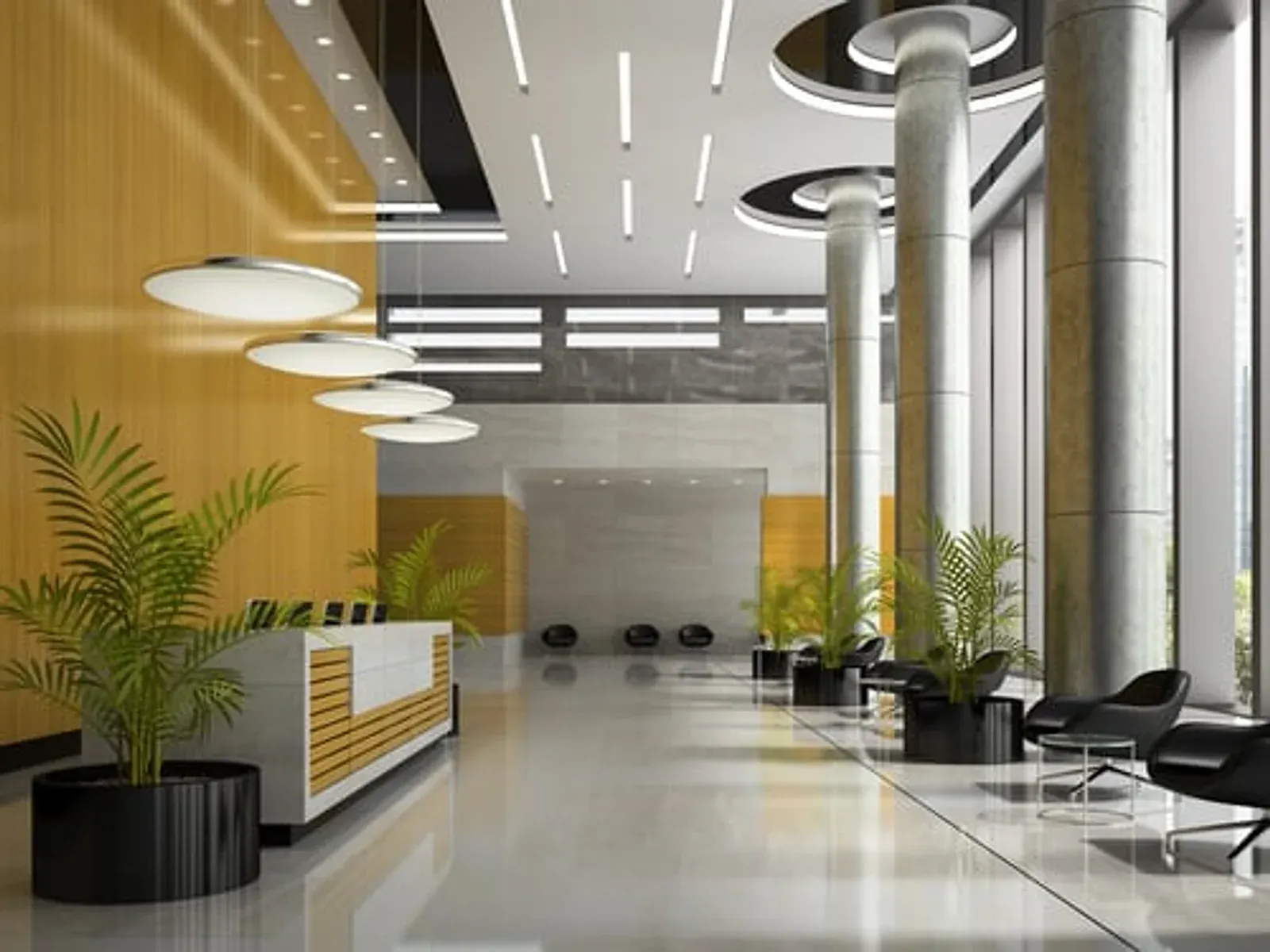 Bright modern commercial lobby with a reception desk and warm yellow accents