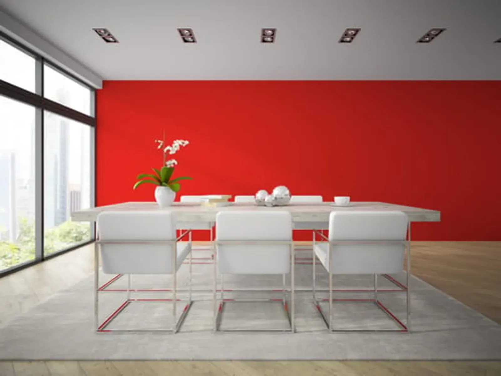 Modern commercial conference room with a bold red painted accent wall